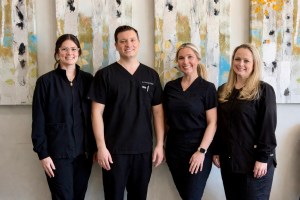 Dr. Robert Trecapelli and team (3 women) at Dr. Trecapelli's dental office in Shelby Township, MI
